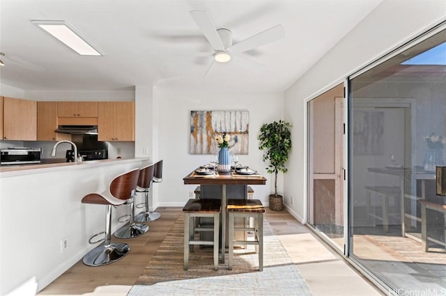 kitchen featuring light wood-type flooring and ceiling fan