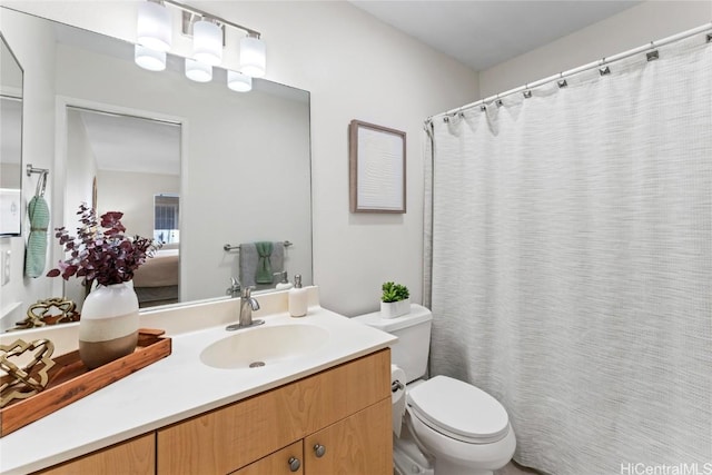 bathroom with toilet and vanity