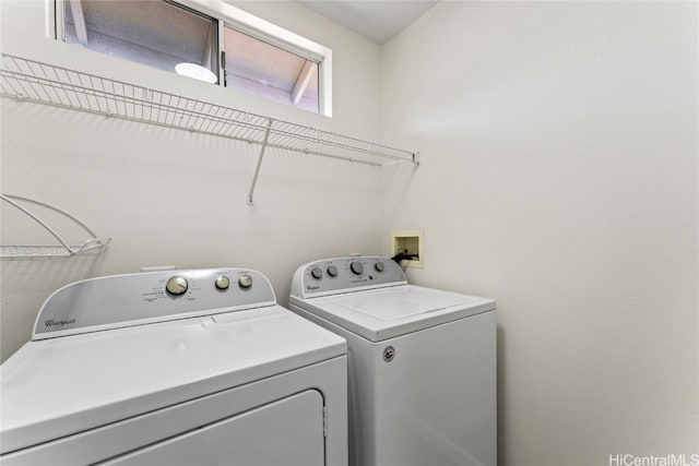 laundry area with independent washer and dryer