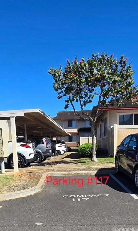 view of car parking featuring a carport