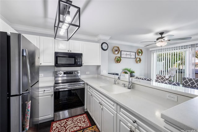 91-1022 Huliau St Unit 1A, Ewa Beach, HI 96706 - kitchen featuring appliances with stainless steel finishes, white cabinetry, light countertops, ornamental molding, and a ceiling fan