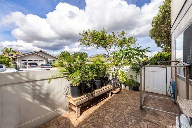 view of patio / terrace featuring fence