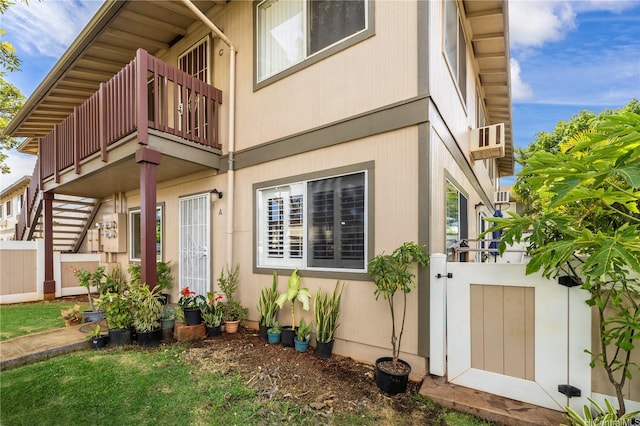 91-1022 Huliau St Unit 1A, Ewa Beach, HI 96706 - view of side of home with a gate, fence, and a balcony