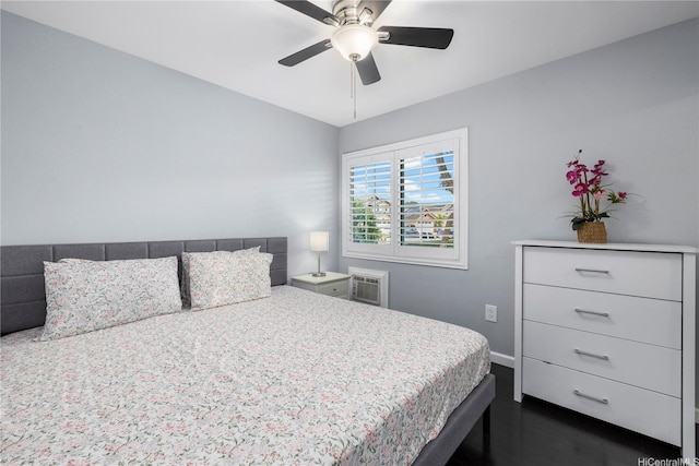 91-1022 Huliau St Unit 1A, Ewa Beach, HI 96706 - bedroom with dark wood-style flooring, a ceiling fan, and a wall unit AC
