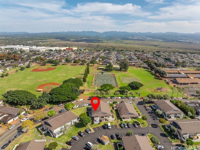 birds eye view of property featuring a mountain view