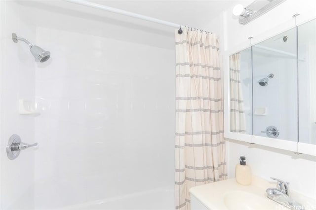 bathroom featuring vanity and shower / tub combo