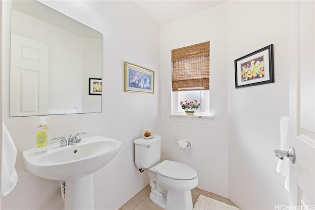 bathroom featuring tile patterned flooring and toilet