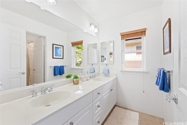 bathroom with tile patterned flooring and vanity