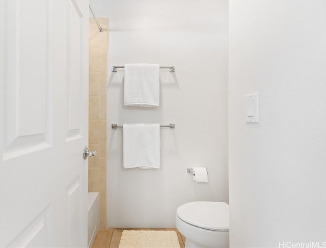 bathroom with tile patterned floors and toilet