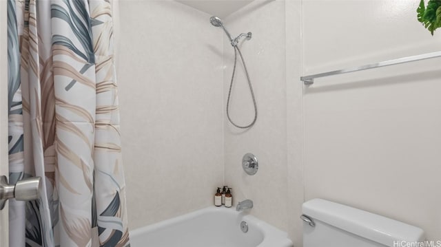 bathroom with toilet and shower / tub combo with curtain