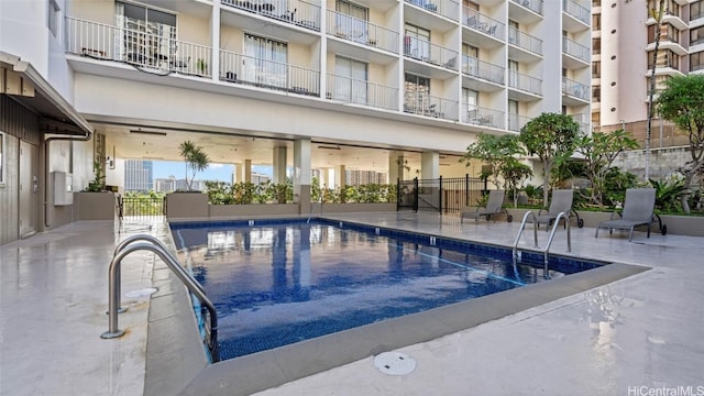 view of swimming pool featuring a patio