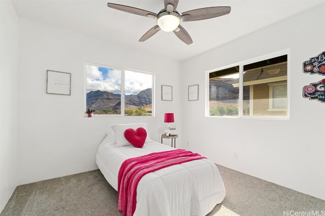 bedroom with ceiling fan and carpet