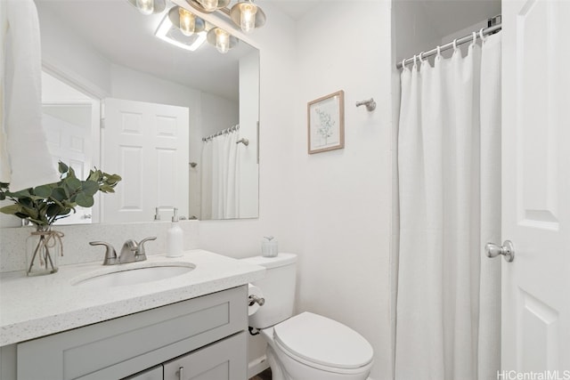 bathroom featuring vanity, walk in shower, a notable chandelier, and toilet