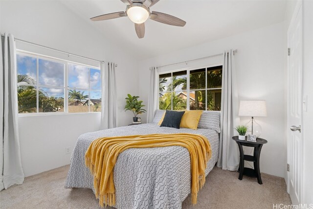 carpeted bedroom featuring lofted ceiling and ceiling fan