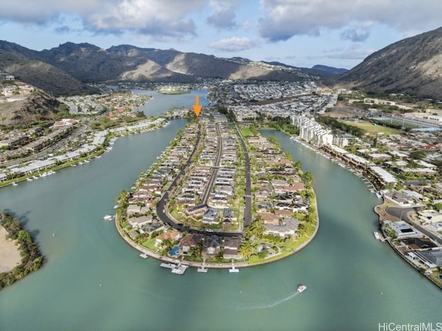 aerial view featuring a water and mountain view