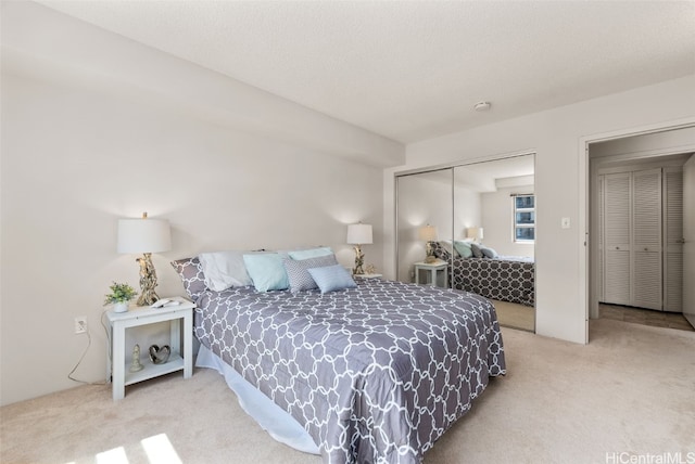 carpeted bedroom featuring a closet