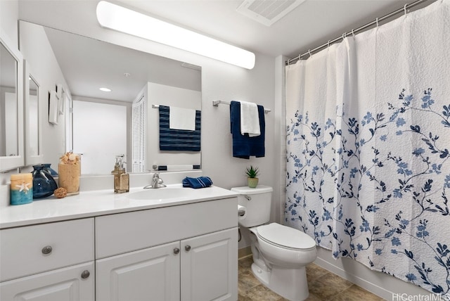 full bathroom with vanity, shower / tub combo, and toilet