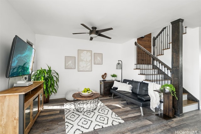 living room with ceiling fan and dark hardwood / wood-style floors