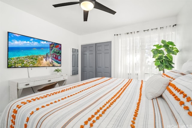 bedroom featuring ceiling fan and a closet