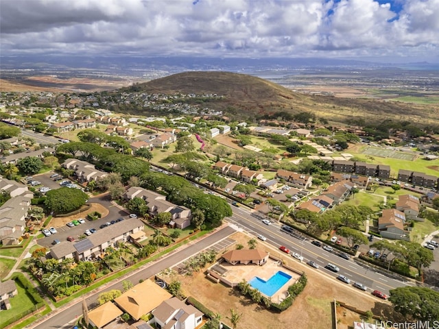 birds eye view of property featuring a mountain view