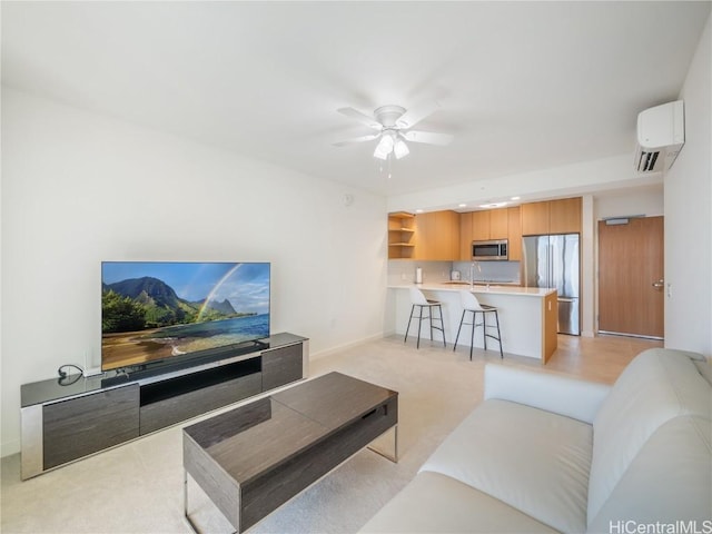 carpeted living room with a wall mounted AC, ceiling fan, and sink