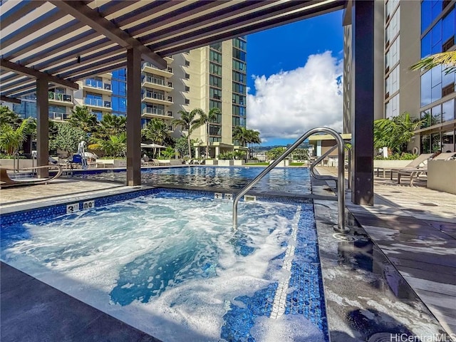 view of pool featuring a community hot tub