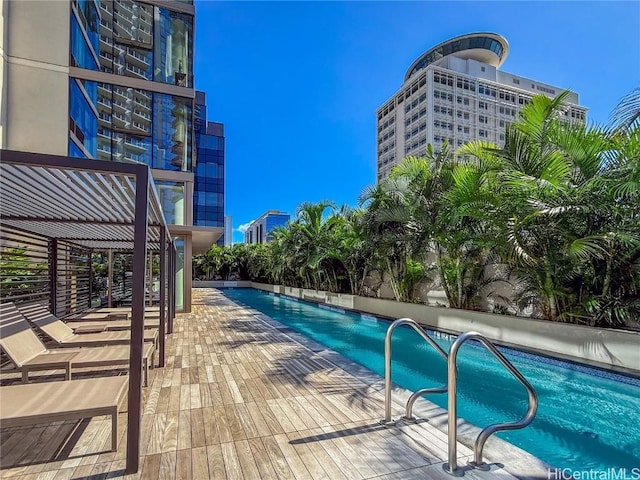 view of swimming pool with a patio