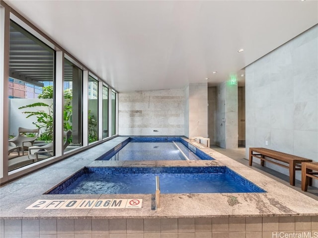 view of pool with an indoor in ground hot tub