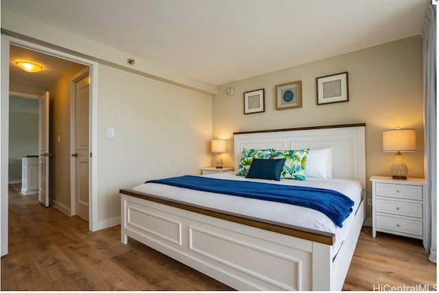 bedroom featuring hardwood / wood-style floors