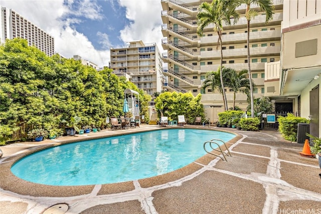 view of swimming pool with central AC