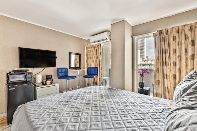 bedroom with fridge, light hardwood / wood-style flooring, and a wall mounted air conditioner