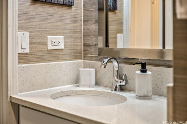 bathroom with backsplash and vanity