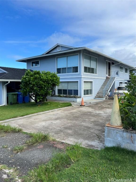 view of front of property with a front lawn