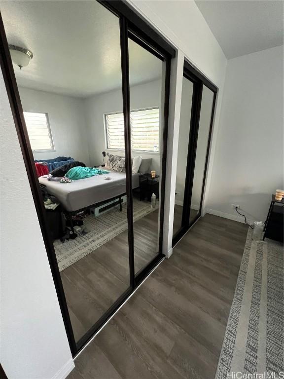 interior space featuring dark hardwood / wood-style flooring and multiple windows