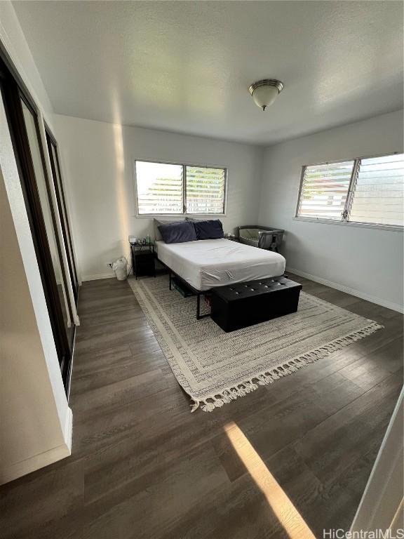 bedroom featuring dark hardwood / wood-style flooring