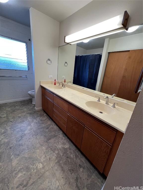 bathroom featuring toilet and vanity