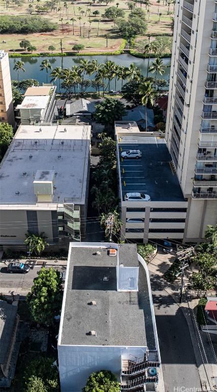 birds eye view of property with a water view