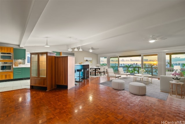 unfurnished living room with ceiling fan, dark parquet floors, and lofted ceiling with beams