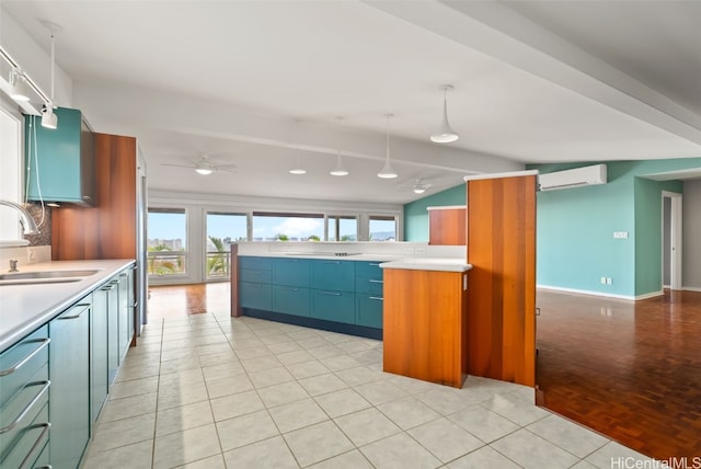 kitchen with backsplash, sink, a wall mounted AC, decorative light fixtures, and light tile patterned flooring