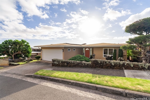 ranch-style home with a garage