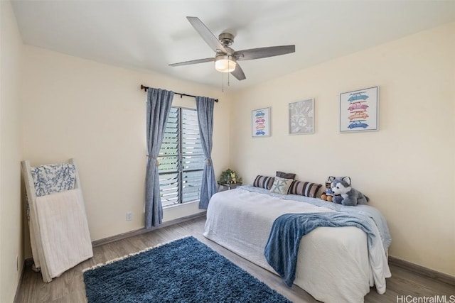 bedroom featuring ceiling fan and hardwood / wood-style flooring