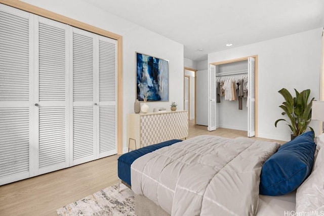 46-145 Humu Pl, Kaneohe, HI 96744 - bedroom with multiple closets, wood finished floors, baseboards, and recessed lighting