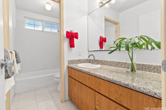 full bathroom featuring tile patterned flooring, vanity, toilet, and tiled shower / bath combo