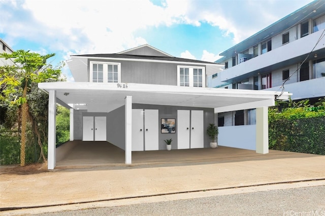 view of front of property with a carport