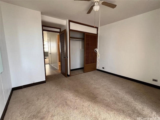 unfurnished bedroom with carpet flooring, ceiling fan, and a closet