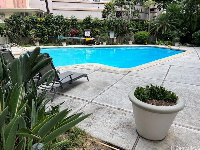 view of swimming pool featuring a patio area