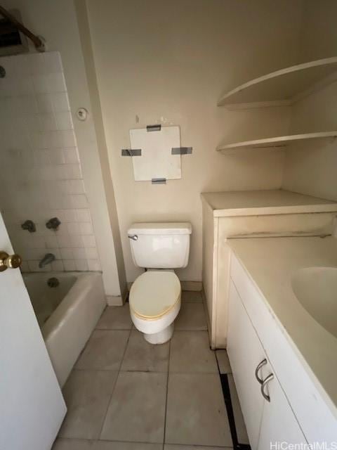 bathroom featuring tile patterned floors, vanity, and toilet