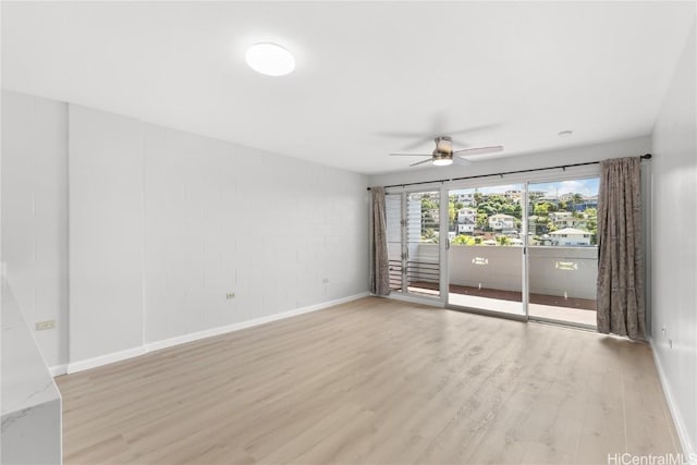 spare room with ceiling fan and light hardwood / wood-style flooring