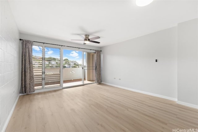 empty room featuring ceiling fan and light wood-type flooring