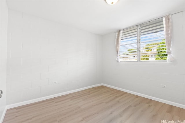 unfurnished room featuring light hardwood / wood-style floors